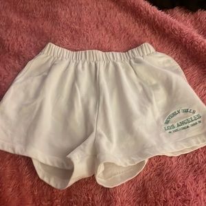 white comfy thigh length shorts, stretchy, size extra small but SUPER stretchy